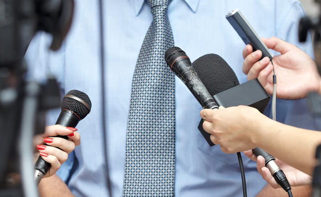 General Election 2015 - image - man in suit being interviewed with microphones